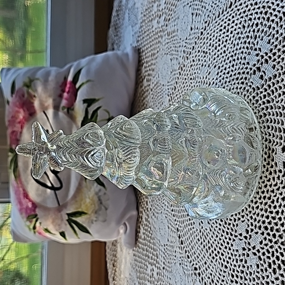 Iridescent clear class christmas tree decor has teddy bear and train